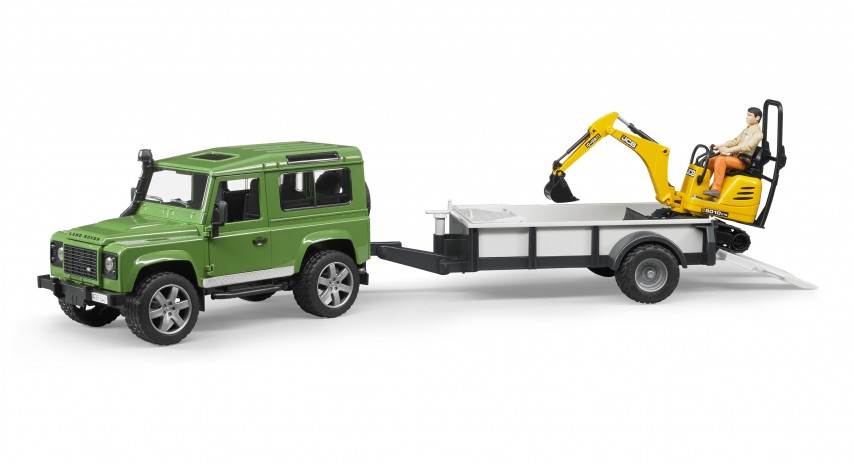 Land Rover Defender with trailer, CAT and man